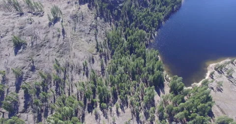 Top down view flying over mountain and small lake Video stock 62795849