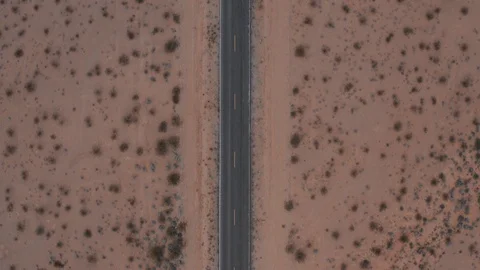 Top down view flying over a desert road to nowhere Vidéo 105550379