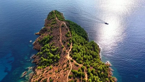 Top down view from a forested peninsula to a turquoise bay, Thassos Stock Footage 347172117