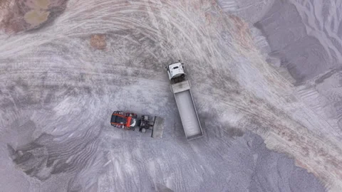 Top-down view of a forklift loading materials into a flatbed truck at an Stock Footage 335475396