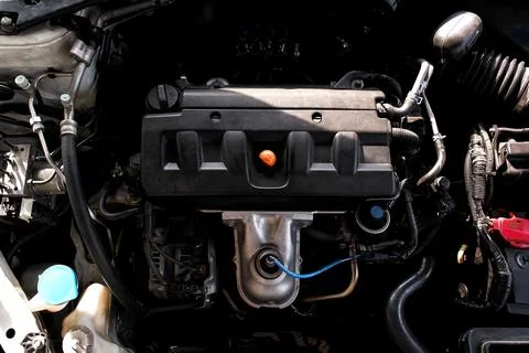 Top-down view of a four-cylinder car engine bay Stock Photos