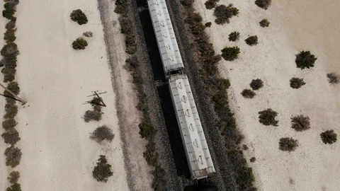 Top Down View of Freight Train in Desert - Aerial Drone Stock Footage 114485408