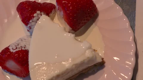 Top down view of fresh cheesecake dessert with strawberries and cream. Stock Footage 334262536