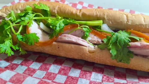 Top down view of fresh crispy Subway sandwich with ham, tomato, cucumber, l.. Video stock 318253981