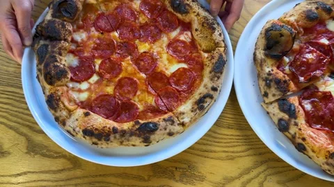 Top Down View of Fresh Neapolitan Pepperoni Pizza Served on Wooden Table Stock Footage 337519560