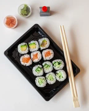 Top down view of fresh take away sushi on a white background with copy space 写真素材