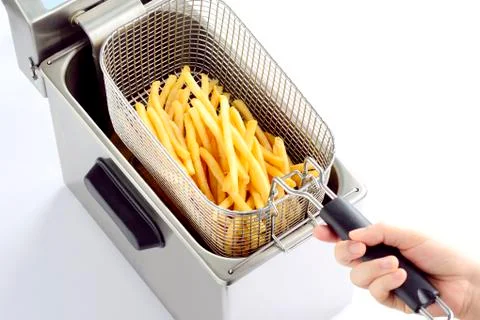 Top down view fried potatoes from deep fry pan after frying on white background. Stock Photos