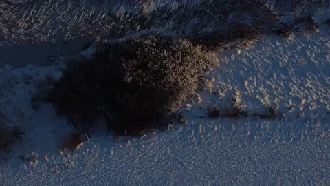 Top-down view of frozen river and snowy fields, 2K Video stock 196036855