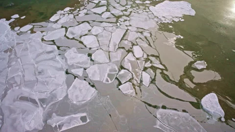 Top-down view of geometric ice formations floating on the Great Lakes surface. Stock Footage 337721257