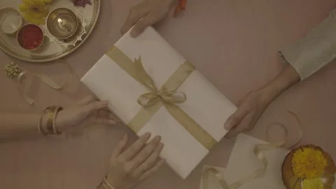 Top-down view of a gift exchange with festive Indian decorations Stock-Footage 327595445