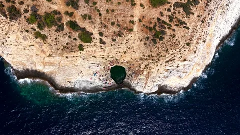 Top down view of the Giola natural pool on the rocky coast of Thassos Stock Footage 347175374