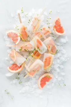Top down view of grapefruit thyme popsicles in a pile. Stock Photos