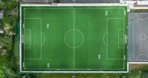 Top down view on a green, empty soccer field 4k Stock Footage 250345519
