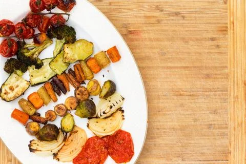 Top down view of grilled veggies on plate Stock Photos