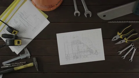 Top down view. A guy making notes from the schematics Stock Footage 80016502