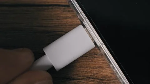 Top Down View Hand Connecting USB C Cord To Smartphone Stock Footage 324634265