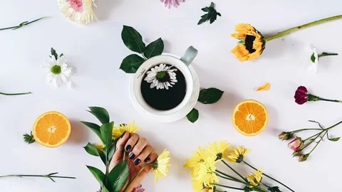 Top down view hand flowers, hand with coffee and fruit, floral Stock Footage 306711013