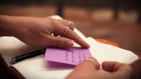 Top down view of hand writing in aesthetic journal Stock Footage 336721122