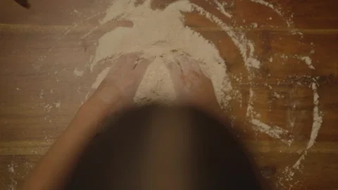 Top-down view of hands in flour Stock Footage 336374692