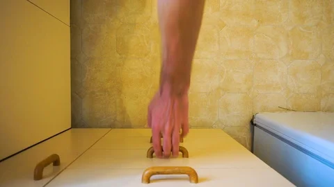 Top down view as hands open kitchen draw, search through mess of utensils 스톡 동영상 105349135