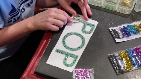 Top Down View of Hands Placing Rhinestones on Art  DIY Craft Stock Footage 331964498