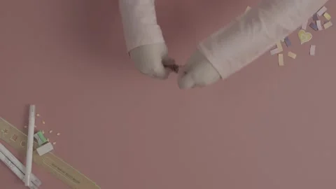 Top down view of hands tying a decorative gold tassel. Stock-Footage 330239578