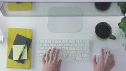 Top Down View of Hands Using a Bluetooth Keyboard and Mouse at a Desk Stock Footage 208757686