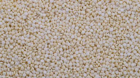 Top down view. Heap of raw dry couscous (kuskus) groats, cereals. Slider shot Stock-Footage 296524127
