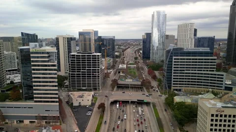 Top down view of heavy traffic on highway passing through Dallas downtown, .. Stock Footage 323427434