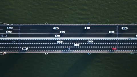 Top down view of highway traffic flows in both directions on a wide bridge Video stock 308844888