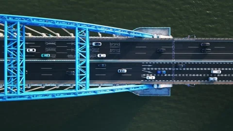 Top down view of highway traffic flows in both directions on a wide bridge Stock-Footage 309799281