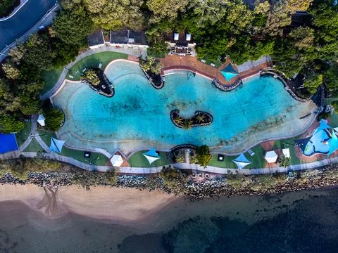 Top down view of hotel pool by the beach Stock Photos
