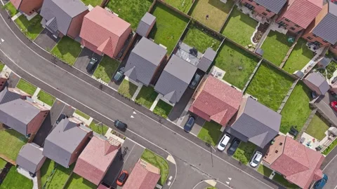 Top down view of houses and street on new build housing estate, England Stock Footage 336481560