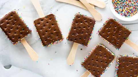 Top down view of ice cream sandwich pops with colourful sprinkles. Stock Photos