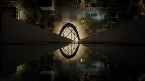 Top down view of illuminated city street and cars reflected symmetrically on 스톡 동영상 332595390