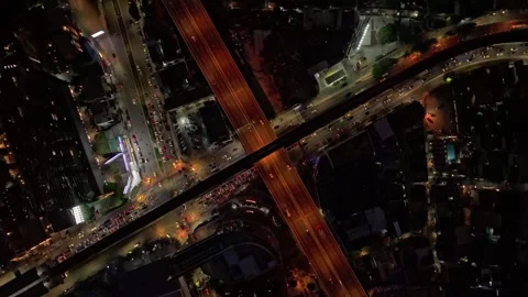 Top down view of illuminated streets bustling in Bangkok night Thailand Stock Footage 304694356
