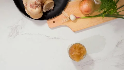 Top-down view of ingredient prep on a marble kitchen counter with a moving Stock Footage 344032034