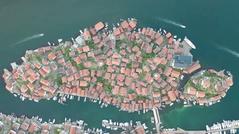 Top down view of island with densely packed houses with red roofs Stock Footage 137945367