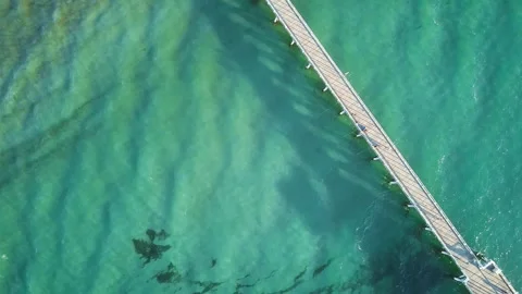 Top-down view. Jetty Sunset over ocean South Australia - Christies Beach Christi Stock Footage 294619632