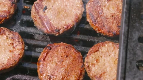 Top Down View of Juicy Beef Burgers being Flame Grilled on Hot BBQ Stock Footage 336480359