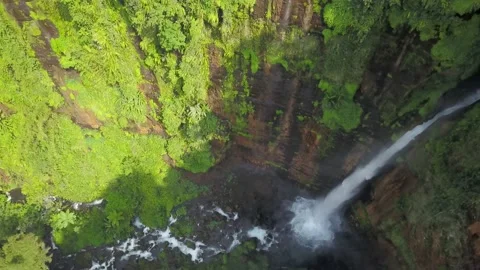Top down view Kapas Biru Waterfall is a hidden paradise in Lumajang, East Java Stock Footage 171060062