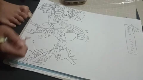 Top-down view of a kid holding a ballpoint pen and sketching on paper Stock Footage 344424797
