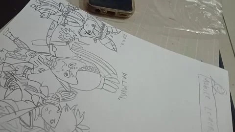 Top-down view of a kid holding a ballpoint pen and sketching on paper Stock Footage 344424798