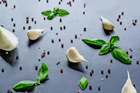 Top Down View On Kitchen Ingredients Like Garlic, Basil, Spices And Herbs On  Stock Photos