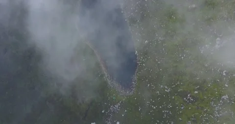 Top down view of lake from above clouds Stock Footage 132298972