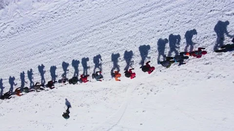 Top down view of a large group of climbers climbing up a snowy slope Stock Footage 228029450
