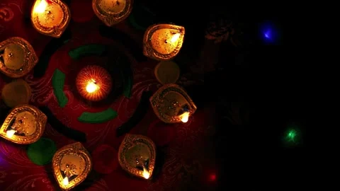 Top Down View of Lit Clay Diyas and Circular Rangoli Pattern Video stock 337514052