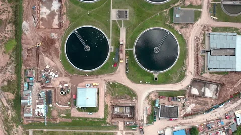 Top down view on little water treatment station. Gulls flying around. Aerial. Stock Footage 141012105
