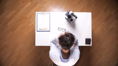 Top down view of a male scientist experiencing extreme stress and burnout Stock Footage 326940225