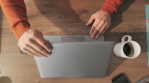 Top down view of man typing on laptop computer zoom out new Stock Footage 148725483